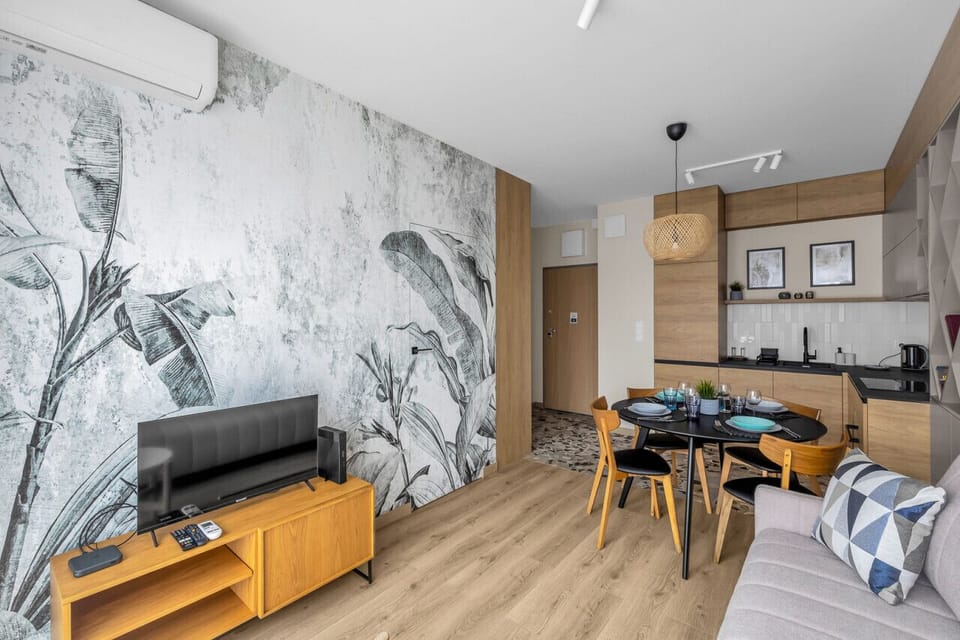 Comfortable Living Room with Sofa Bed and Smart TV | Book Now with RENTUJEMY