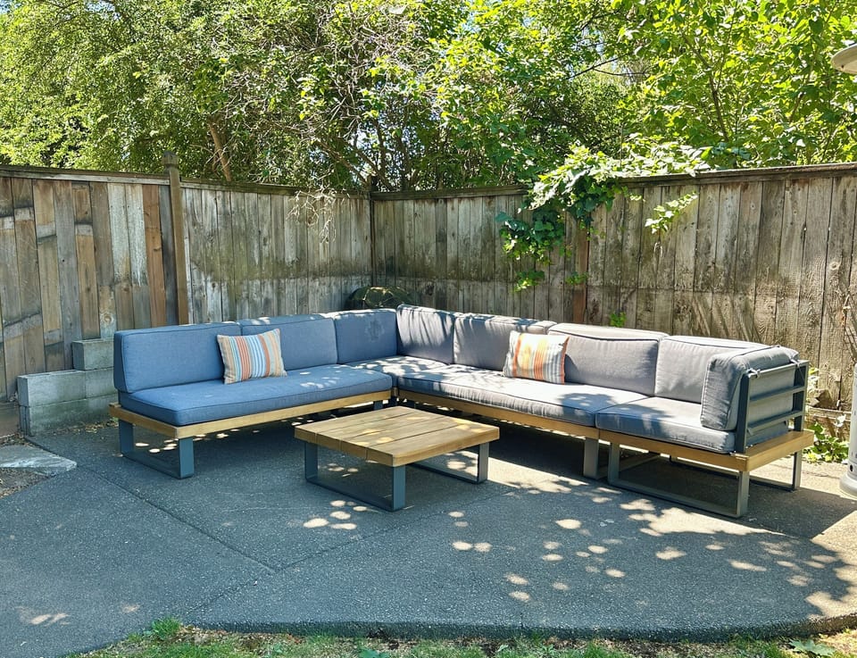 Relax on the lounger in the shaded back yard!