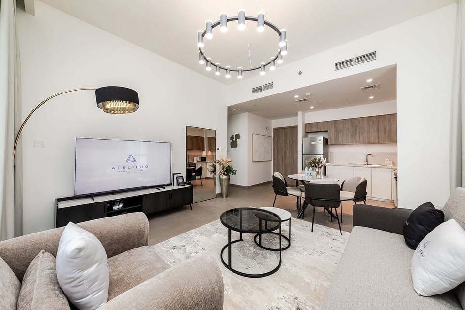 Premium Apartment, 1 Bedroom, Balcony, City View | Living room | 50-inch Smart TV with digital channels