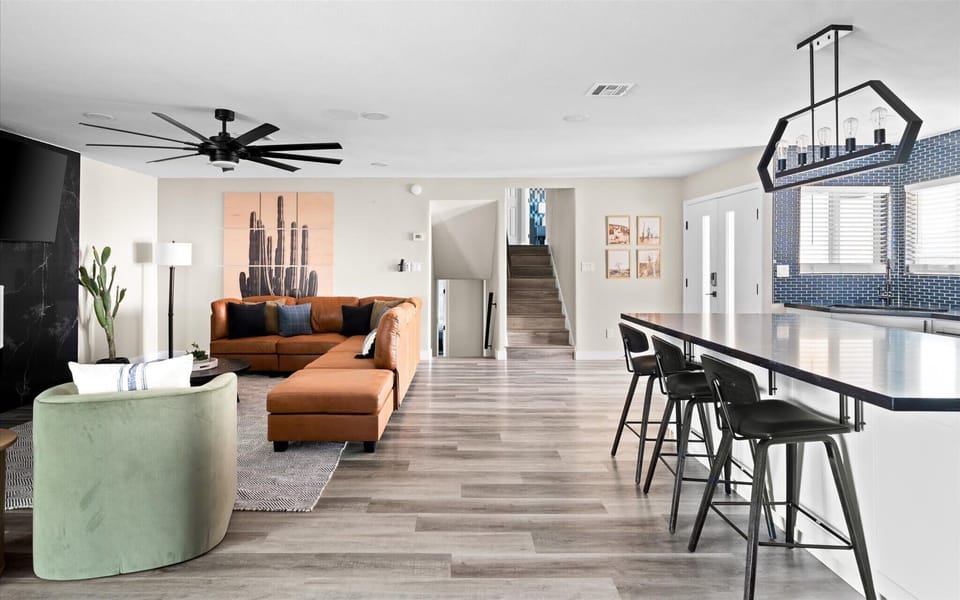 The open concept layout seamlessly connects the entry living area, formal dining area and kitchen