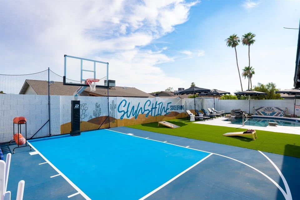 Embrace our backyard paradise with a basketball court, cornhole, private pool, loungers, and more outdoor fun!
