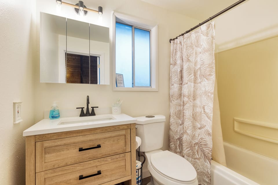 Bathroom 2 offers a shower/tub combo.