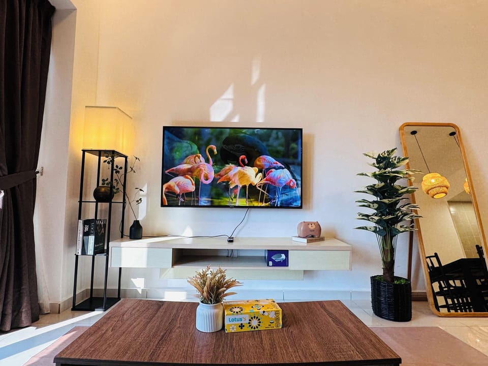 Signature Apartment, City View | Living area | Flat-screen TV