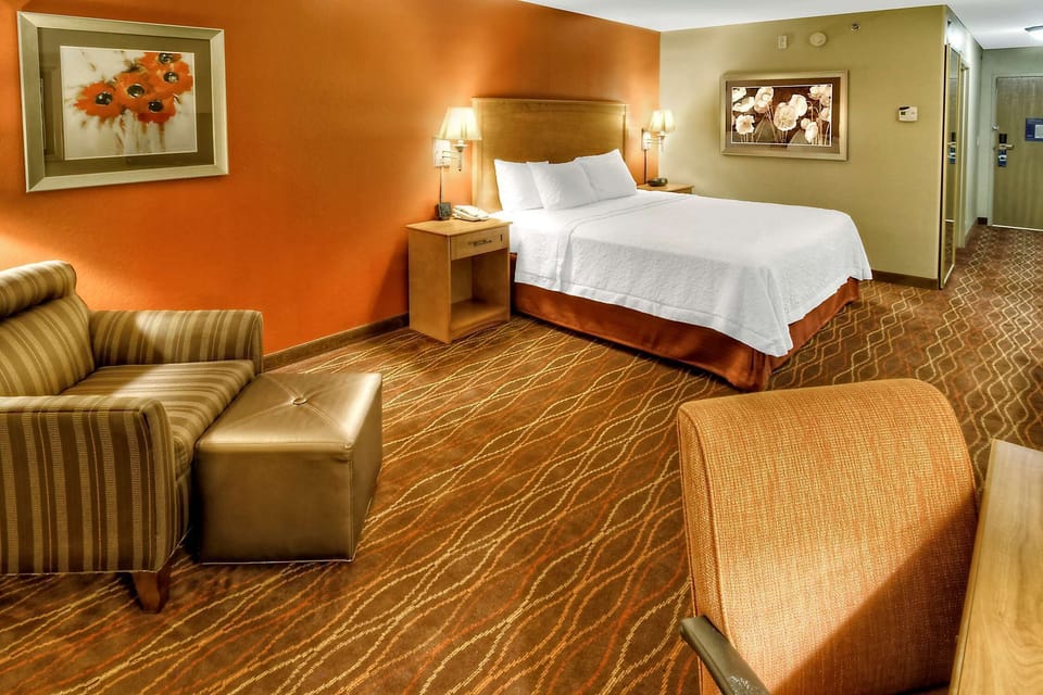 Premium bedding, desk, laptop workspace, blackout drapes