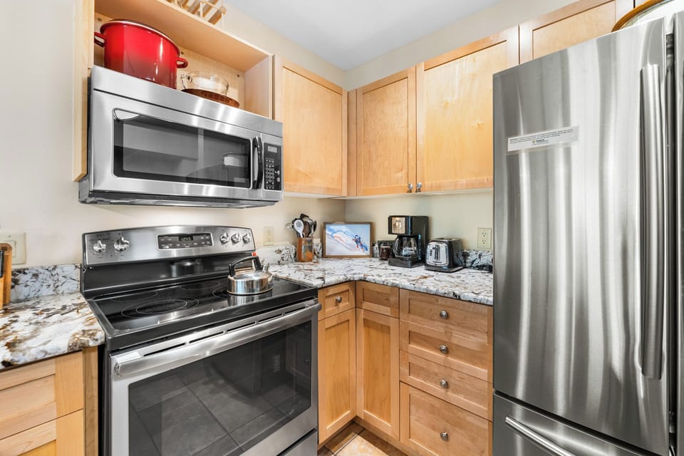 Your fully equipped kitchen features stainless steel appliances and granite countertops, perfect for preparing your favorite meals during your stay.