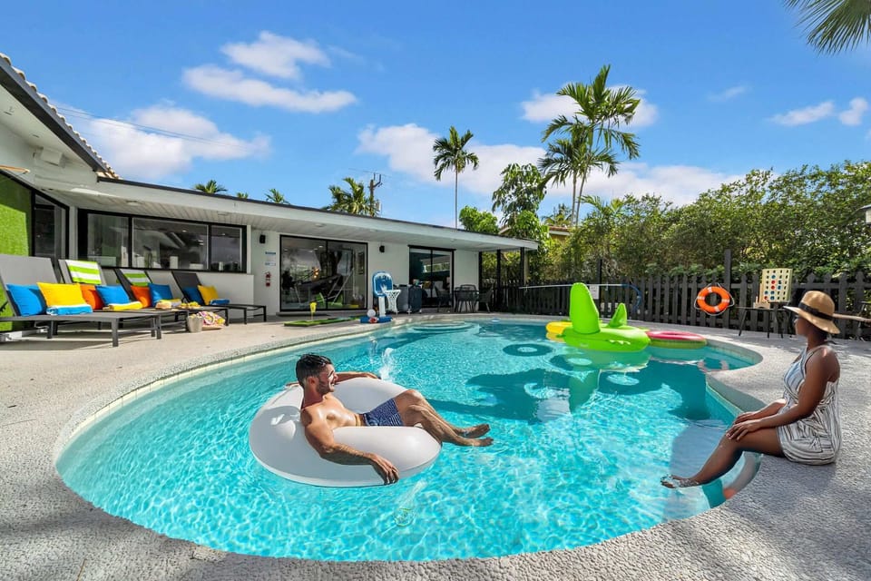 Luxury pool experience with comfortable seating, colorful inflatables, and tropical surroundings. Perfect for family fun and relaxation #PoolLife #FamilyFun #LuxuryPool #TropicalLiving #PoolEntertainment #FamilyTime #LuxuryLiving #PoolActivities 