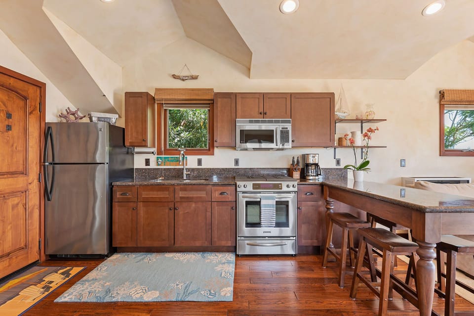 Kitchen with drip coffee maker, toaster, and eat in counter