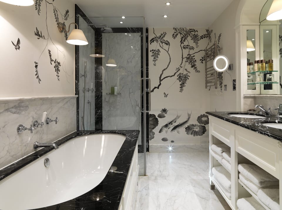 Designer toiletries, hair dryer, bathrobes, slippers