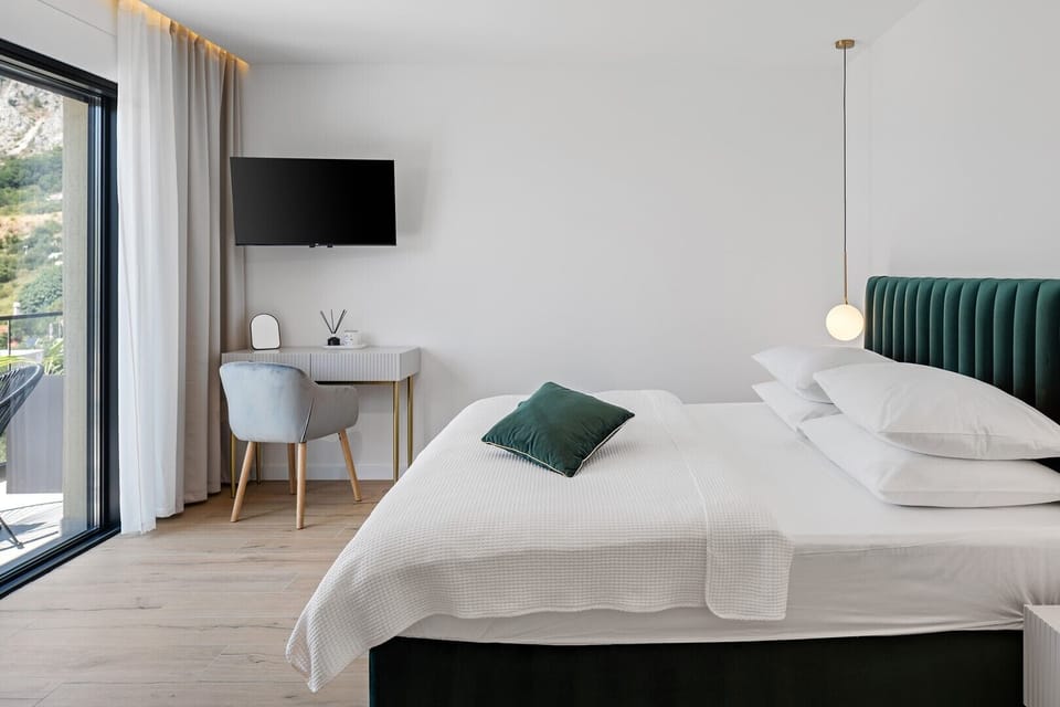 Master Bedroom NO3 includes a king-size bed, en suite bathroom with a shower and a self standing bathtub with a TV,  air conditioning, and a balcony