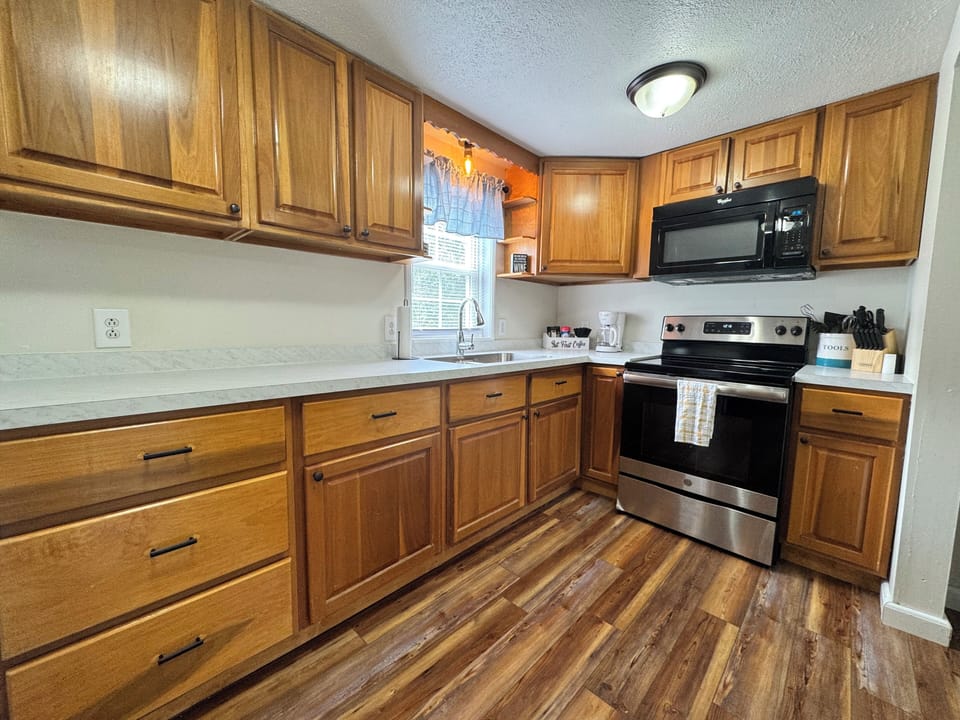 Fully stocked kitchen with coffee bar. 