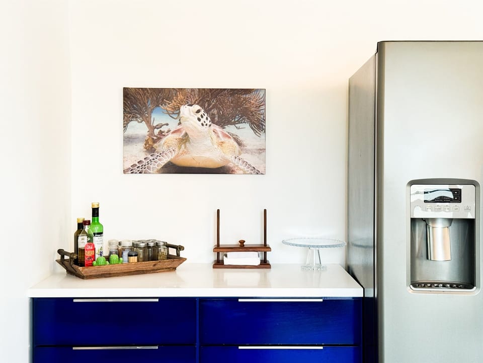 Equipped with all the modern appliances you need, including a large side by side fridge with water and ice dispenser, dishwasher, 5-burner stove, and double oven.