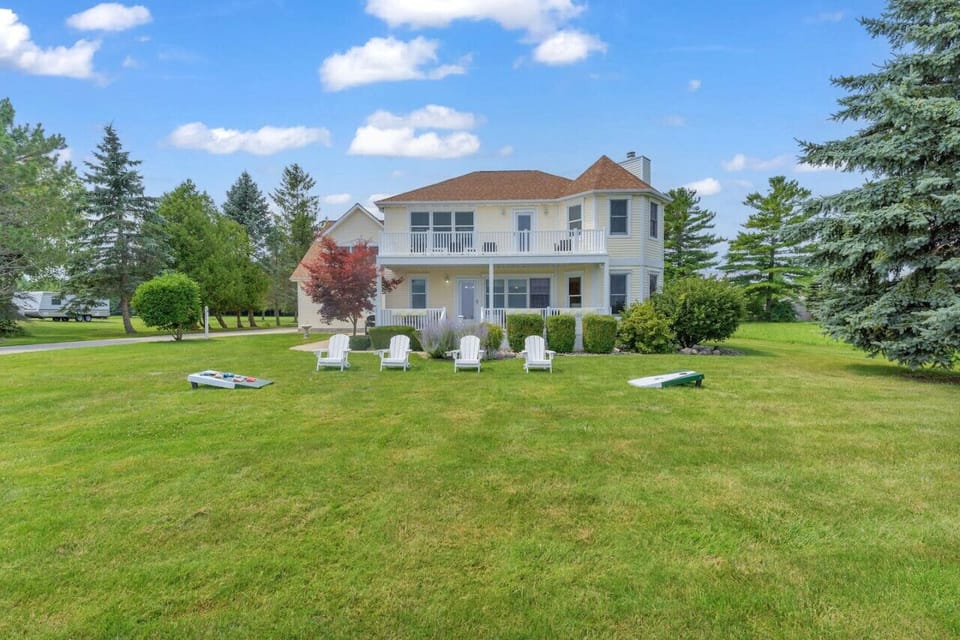 Cornhole and outdoor seating to work on your tan