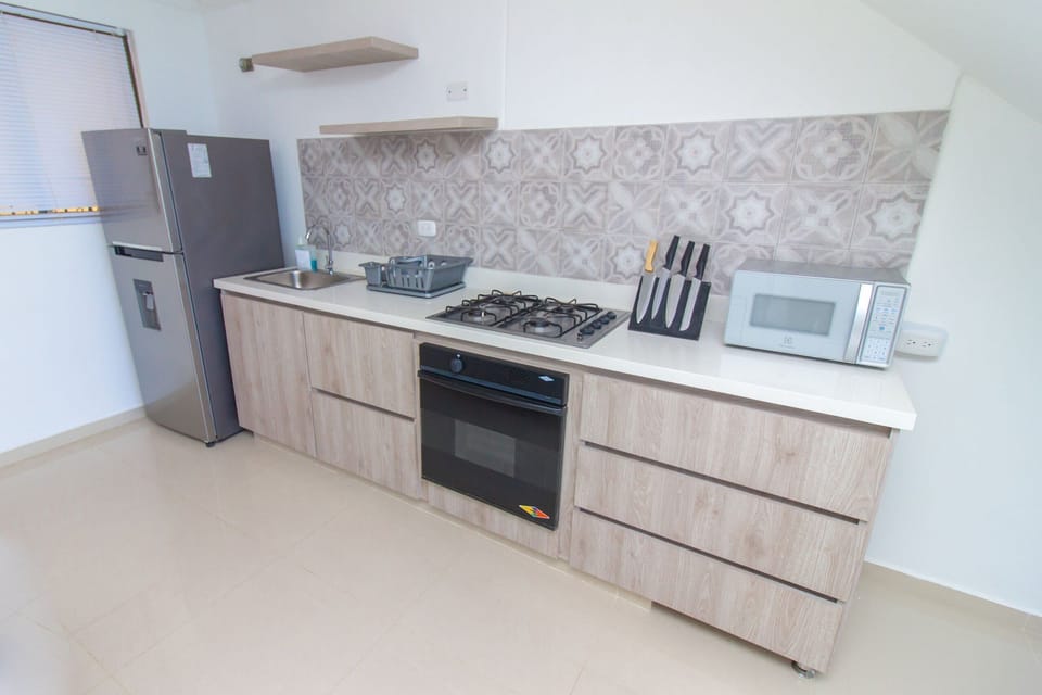 Apartment | Private kitchen | Full-size fridge, microwave, cookware/dishes/utensils