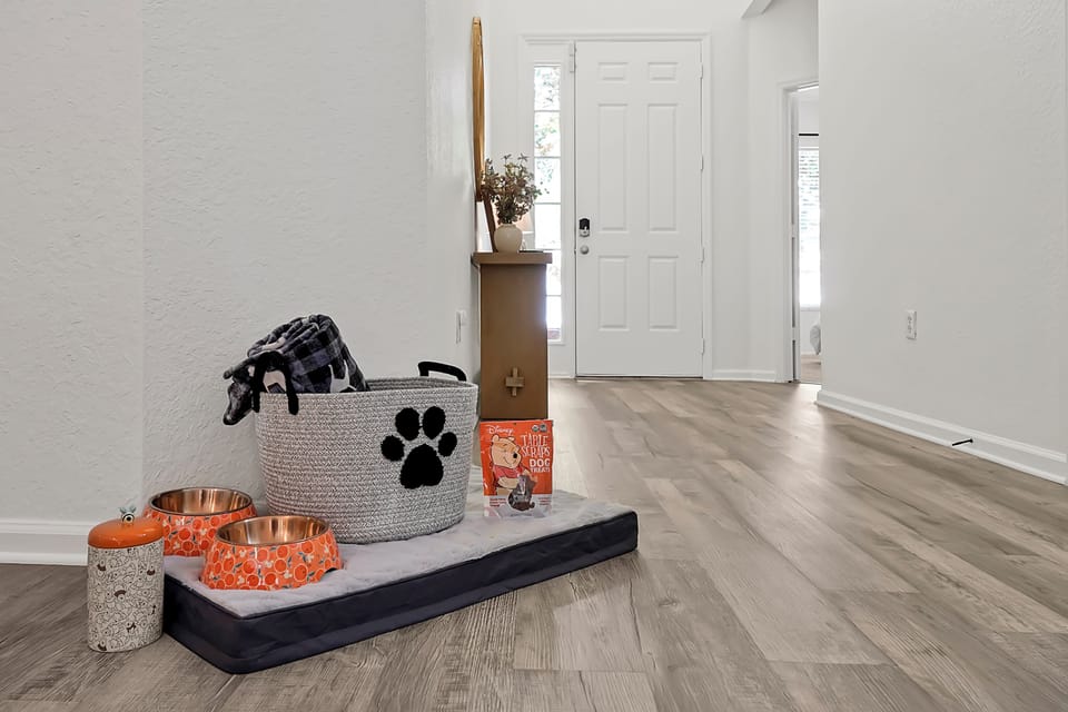 Pet-friendly setup with bed and bowls