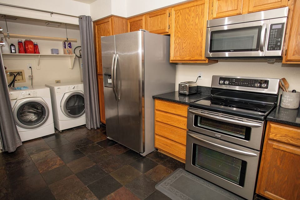 Full size washer dryer makes doing laundry a breeze while cooking gourmet food.