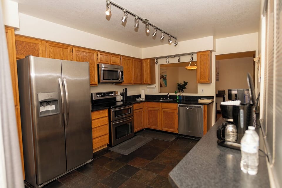 Talk to dinner guests through the open area from Kitchen.