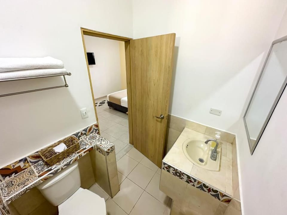 Basic Single Room, 1 Double Bed, Private Bathroom | Bathroom | Shower, free toiletries, towels, soap