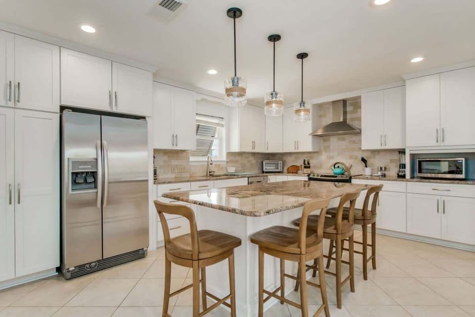The kitchen boasts modern comforts with sleek stainless steel appliances, making it a perfect blend of style and functionality!