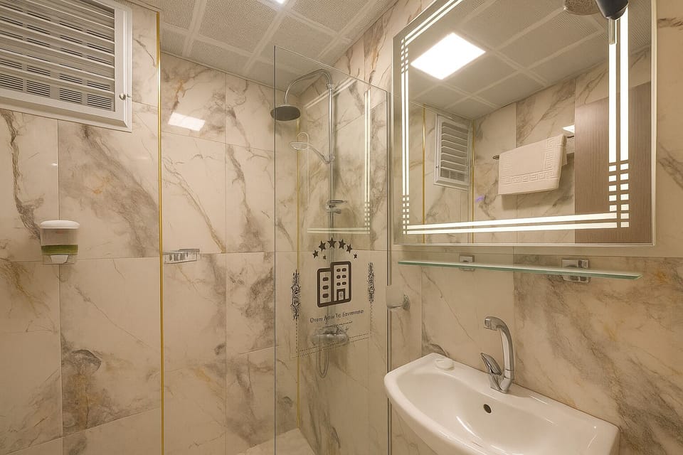 Economy Double Room | Bathroom | Shower, rainfall showerhead, hair dryer, slippers