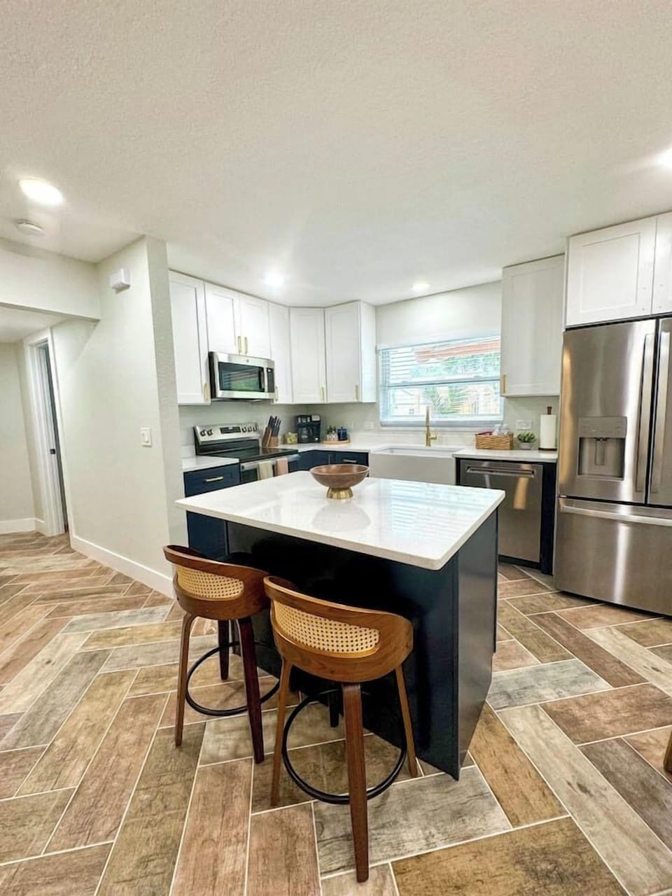 Full kitchen with ample seating and basic kitchen supplies