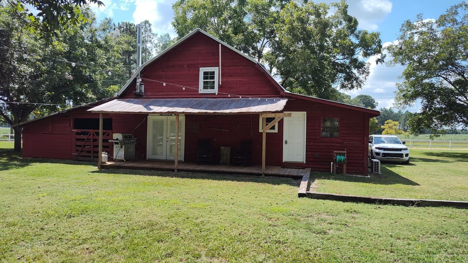 Relax on the porch with your morning coffee that overlooks the horse pasture