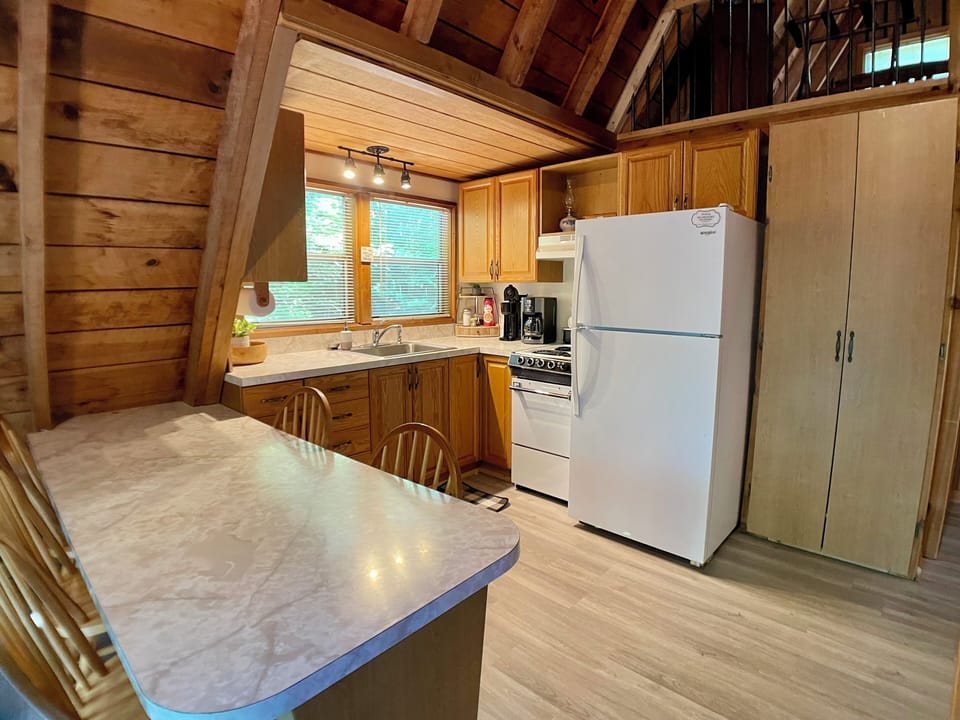 Fully functional kitchen includes spice rack, drip coffee pot, pod coffee maker