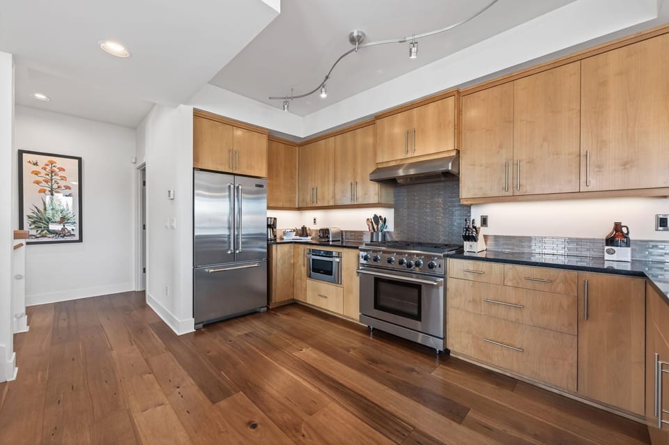 Spacious kitchen with modern appliances and natural light
