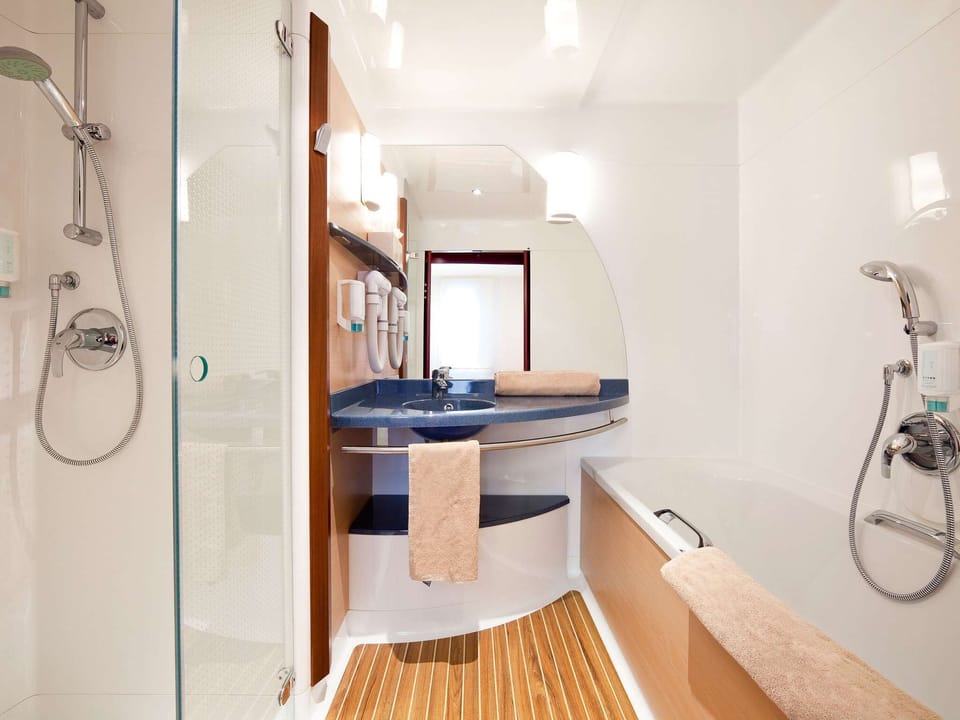 Separate tub and shower, eco-friendly toiletries, hair dryer, towels