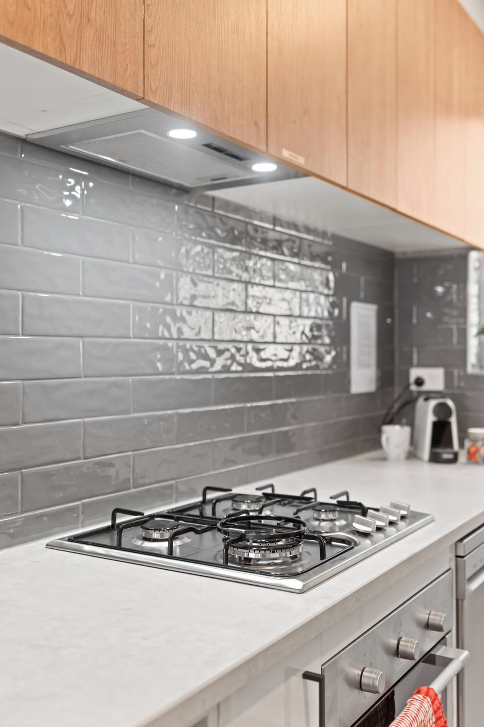 Gas cooktop, Nespresso coffee machine with starter supply of pods and dishwasher for your convenience.