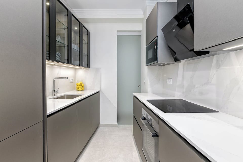 Deluxe Apartment | Private kitchen | Coffee/tea maker, toaster, highchair, cleaning supplies