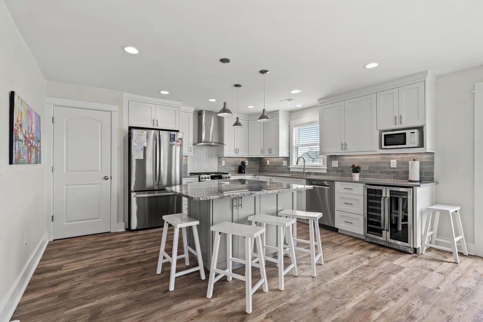The kitchen island provides additional counter space for serving snacks or meals