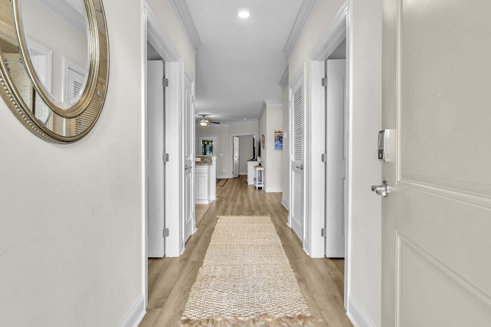 Spacious hallway with convenient access to bedrooms and living areas
