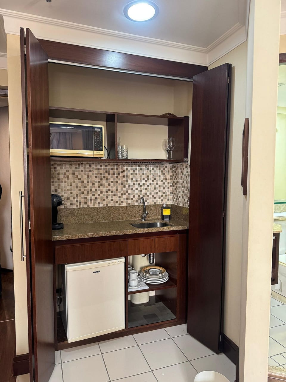 Comfort Apartment | Private kitchen | Cleaning supplies, paper towels