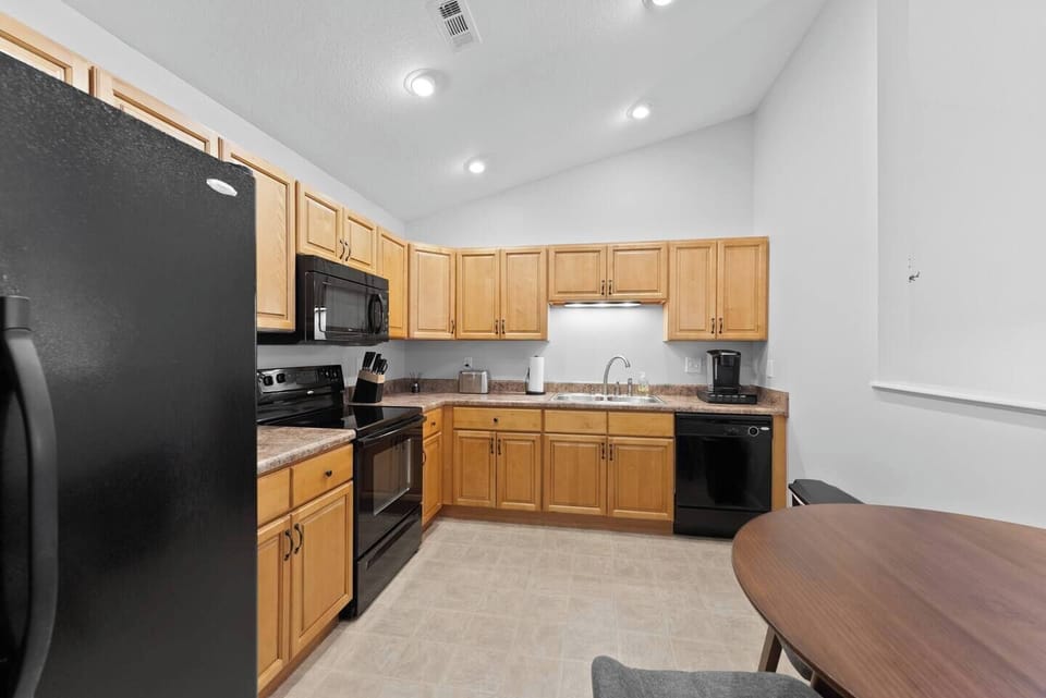 Kitchen comes equipped with a w/Keurig coffee maker, electric stove, and a large fridge. It has all the tools you need for making breakfast, lunch, and dinner!
