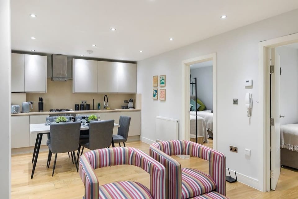 - Open concept living and dining with modern décor style  
- Fully equipped kitchen flows seamlessly with dining area  
- Bright lighting and cozy seating for social gatherings  