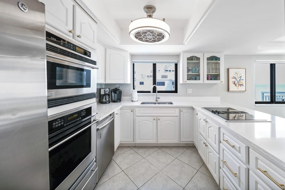 Prepare meals in a fully renovated kitchen with stainless-steel appliances.