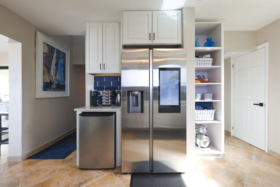 A chef’s dream kitchen with all the latest appliances and amenities. You see that KitchenAid mixer down there?