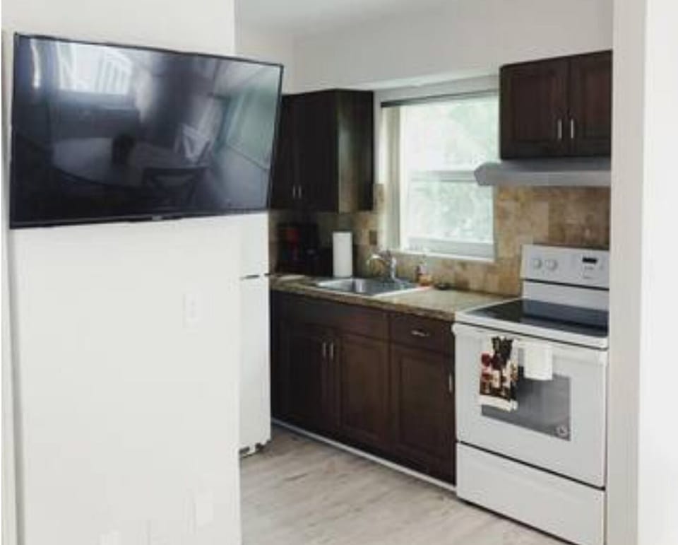 Unleash your culinary creativity in our full-size kitchen. From spacious cabinets to a gleaming fridge and sink, every detail harmonizes to create a culinary haven where inspiration meets functionality.