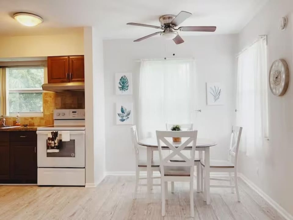 Savor moments at our 4-seater table, where dining elegance meets a glimpse of a stylish kitchen. Adorned with captivating paintings, it's a space where culinary delight and artistic charm converge.
