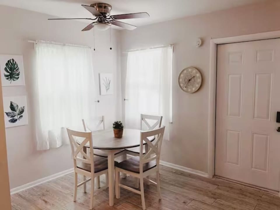 Savor moments at our 4-seater table, where dining elegance meets a glimpse of a stylish kitchen. Adorned with captivating paintings, it's a space where culinary delight and artistic charm converge.