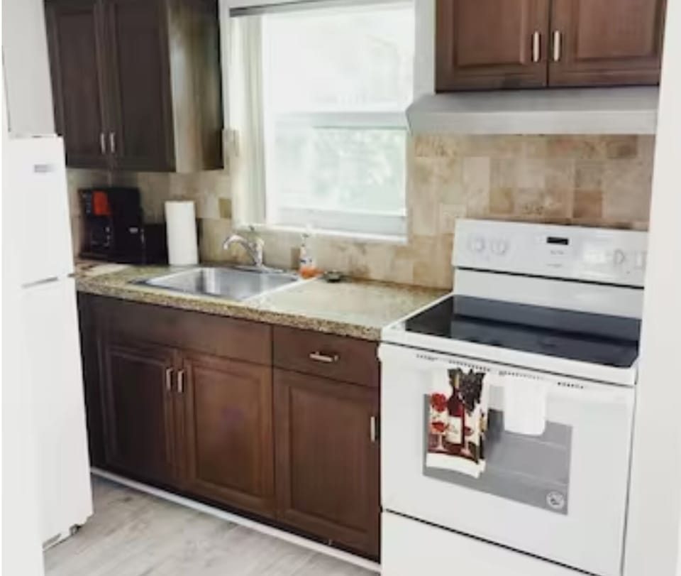 Unleash your culinary creativity in our full-size kitchen. From spacious cabinets to a gleaming fridge and sink, every detail harmonizes to create a culinary haven where inspiration meets functionality.