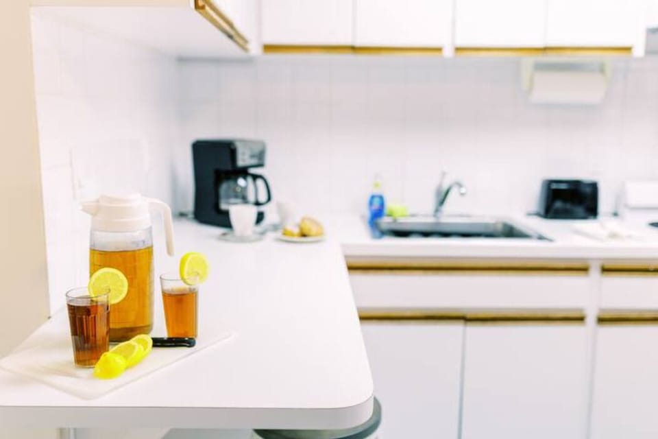Step into culinary charm in our kitchen, where stylish cabinets create a seamless blend of functionality and elegance. A space where every detail is curated for a delightful cooking experience.