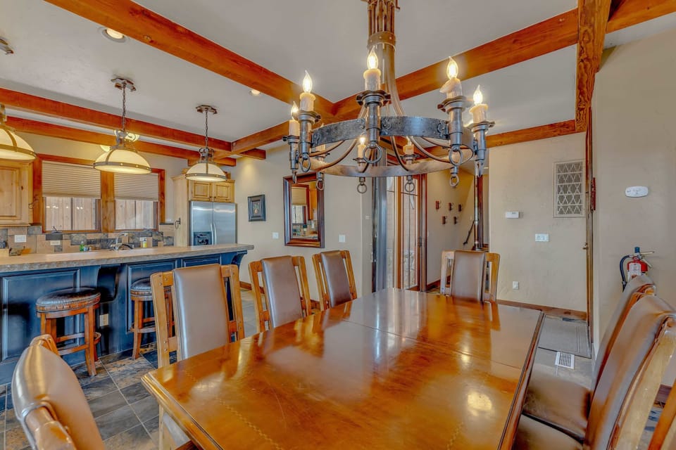 Dining Room: 7-person dining table, access to patio and backyard, connected to kitchen