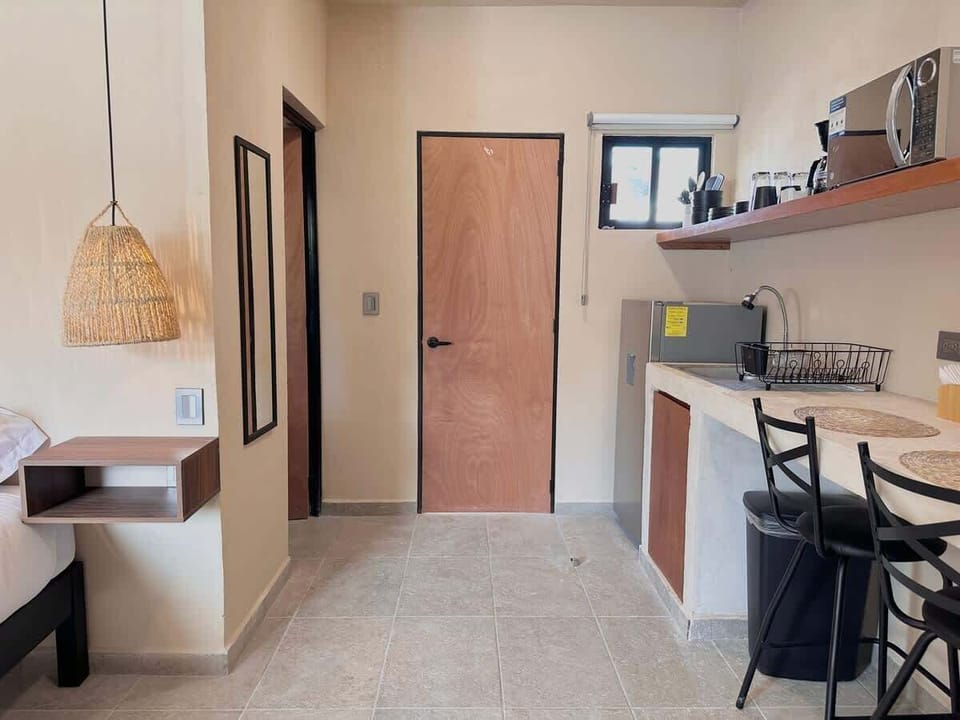 Kitchenette and dining bar at the entrance