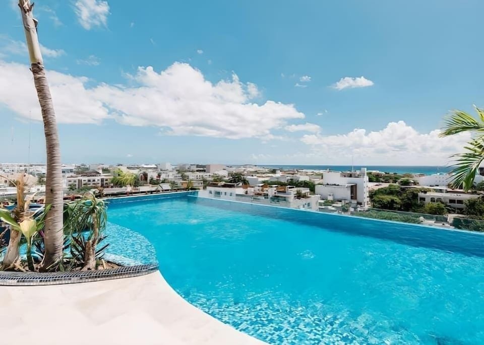 Shared rooftop pool with ocean view