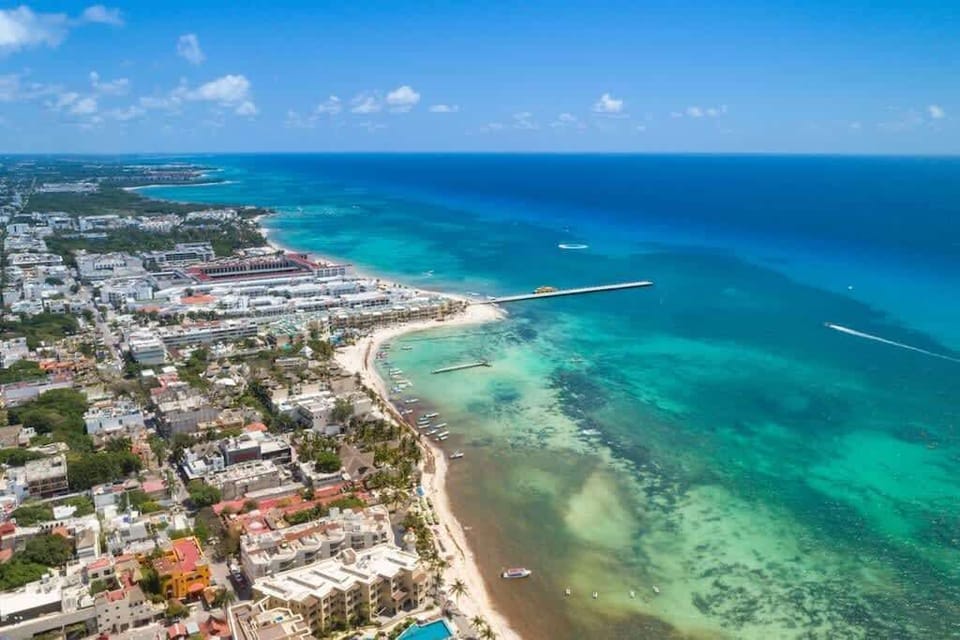 Aerial view of Playa del Carmen's turquoise coast, your Riviera Maya playground