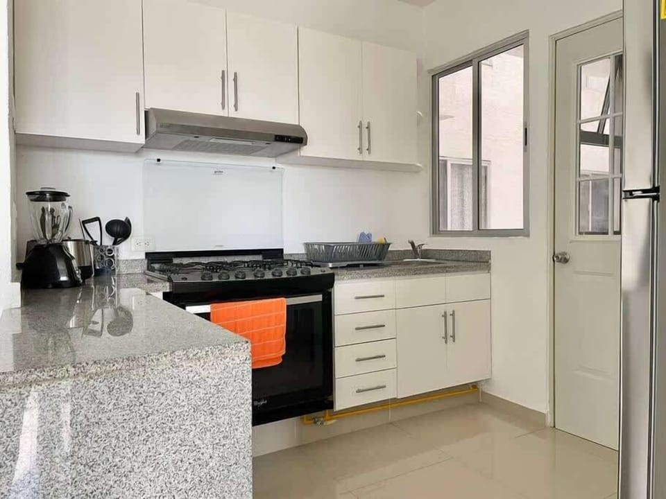 Kitchen with cookware and appliances
