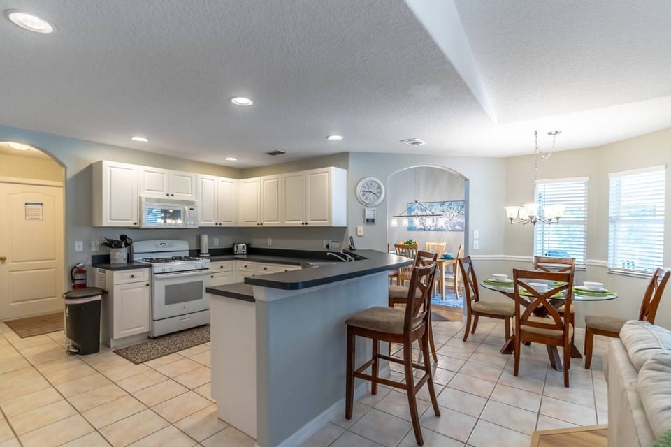 Large kitchen with bar seating and breakfast nook
