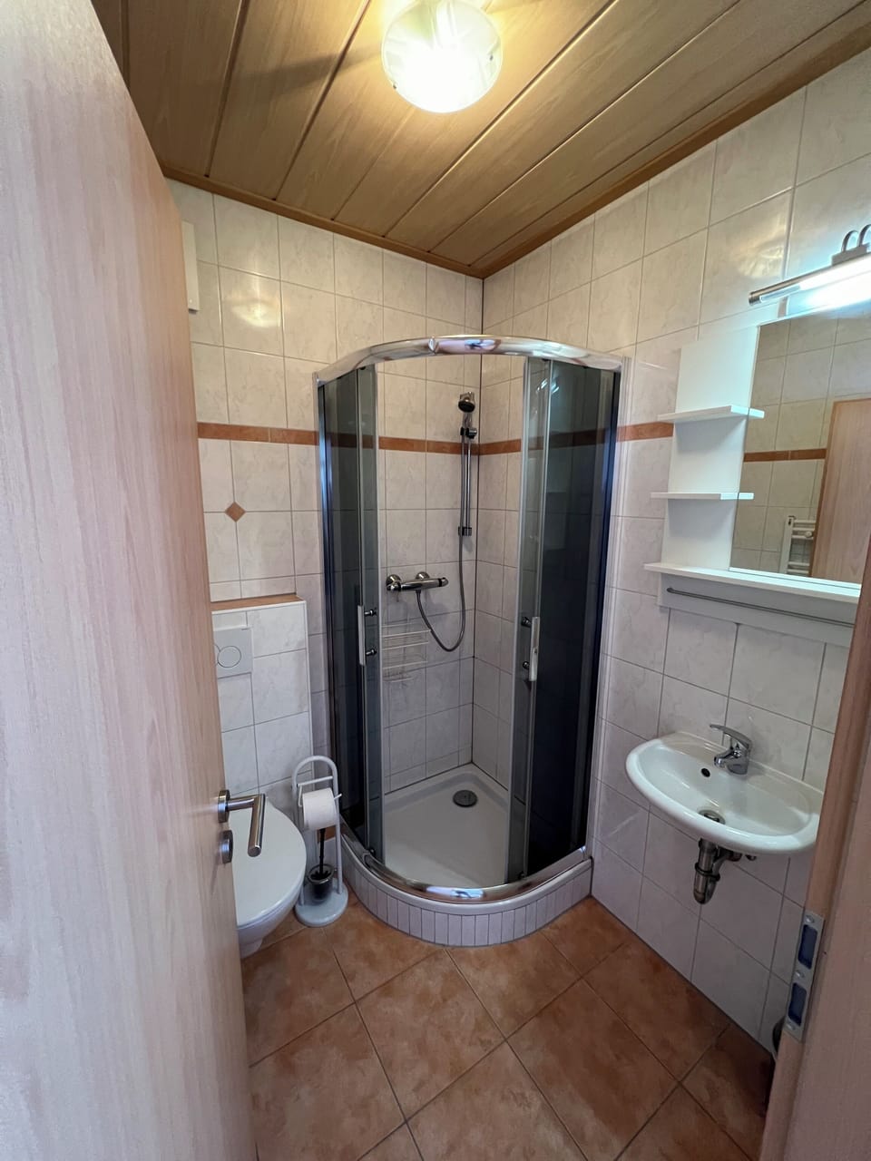 Shower, hair dryer, towels, toilet paper