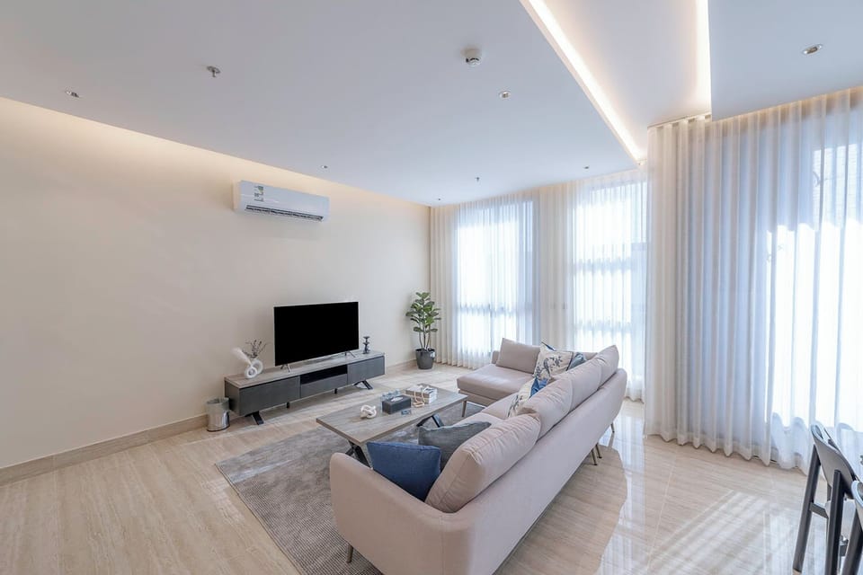 Luxury Apartment, 3 Bedrooms, Balcony, Garden View | Living area | Flat-screen TV